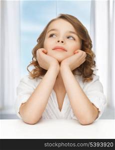 picture of thinking pre-teen girl in casual clothes