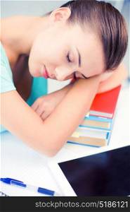 picture of tired student sleeping on stock of books. tired student sleeping on stock of books