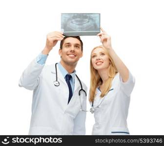 picture of two doctors looking at x-ray