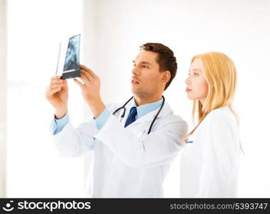 picture of two doctors looking at x-ray