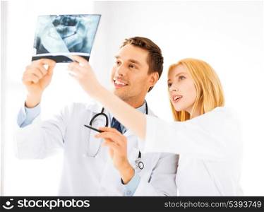 picture of two doctors looking at x-ray