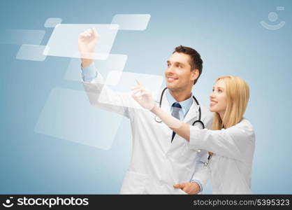 picture of two doctors working with virtual screen