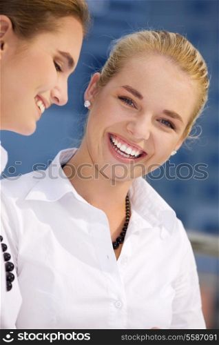 picture of two happy businesswomen (focus on blonde)