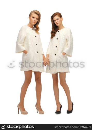 picture of two lovely teenage girls in white coats