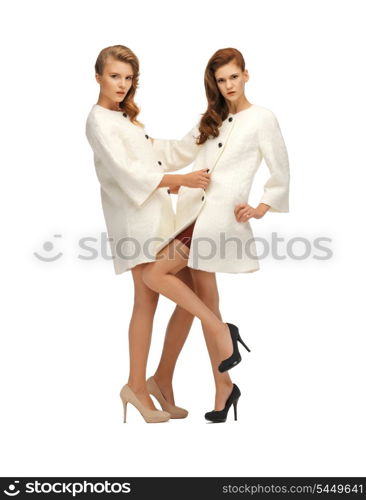 picture of two lovely teenage girls in white coats