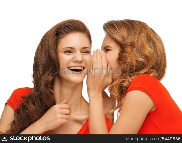 picture of two talking teenage girls in red t-shirts