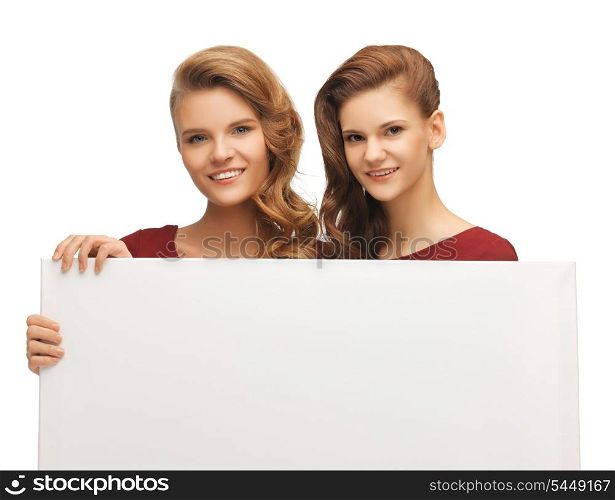 picture of two teenage girls in red dresses with blank board