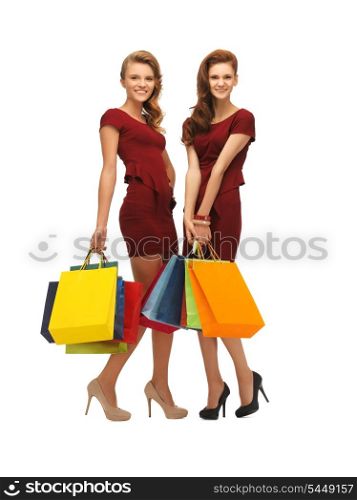 picture of two teenage girls in red dresses with shopping bags