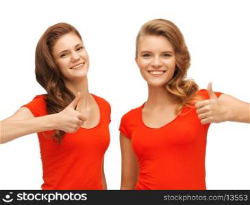 picture of two teenage girls in red t-shirts showing thumbs up