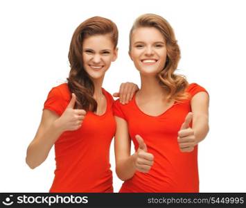 picture of two teenage girls in red t-shirts showing thumbs up