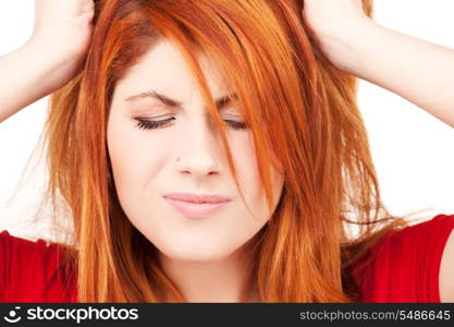 picture of unhappy redhead woman over white