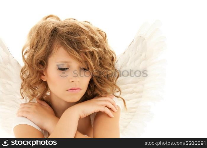 picture of unhappy teenage angel girl over white