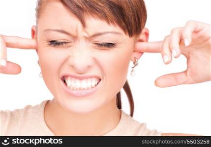 picture of unhappy woman with fingers in ears