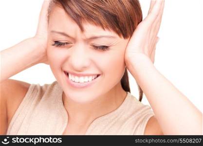 picture of unhappy woman with hands on ears