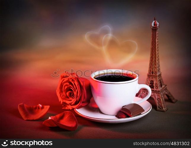 Picture of white cup with morning tea in Valentine day, grunge background, red fresh rose, chocolate candy, decorative Eiffel tower, romantic travel, honeymoon in France, love and romance concept