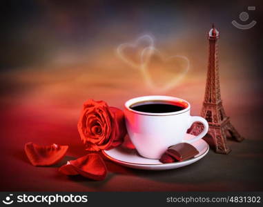 Picture of white cup with morning tea in Valentine day, grunge background, red fresh rose, chocolate candy, decorative Eiffel tower, romantic travel, honeymoon in France, love and romance concept