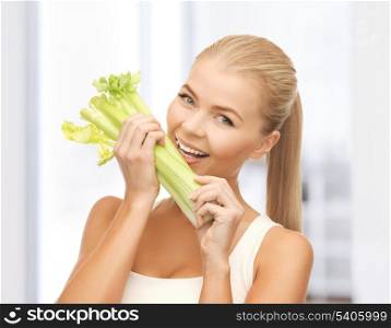 picture of woman biting piece of celery or green salad