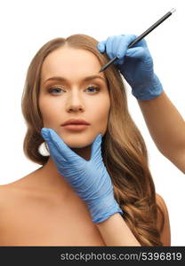 picture of woman face and beautician hands with pencil