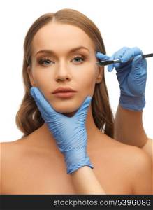 picture of woman face and beautician hands with scalpel