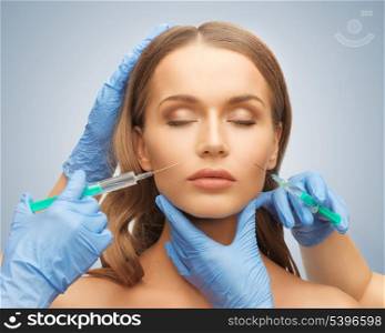 picture of woman face and beautician hands with syringe