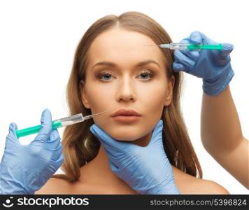 picture of woman face and beautician hands with syringes
