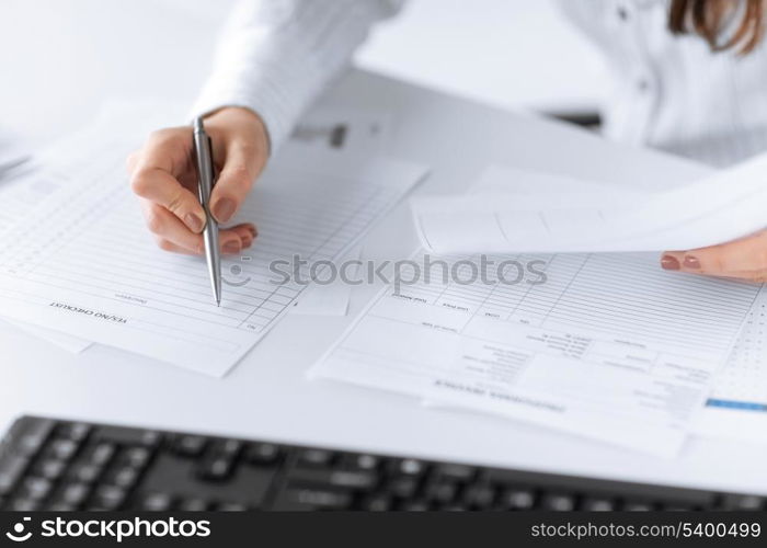 picture of woman hand filling in blank paper or document