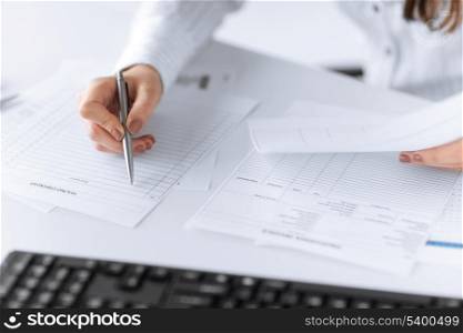 picture of woman hand filling in blank paper or document