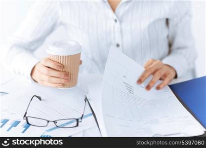 picture of woman hands working with blank paper and drinking coffee