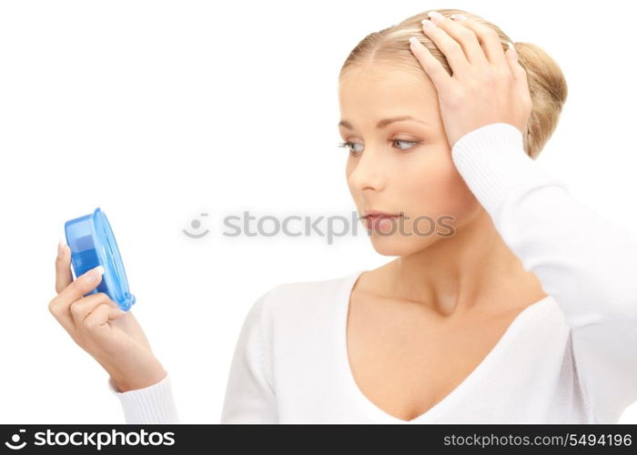 picture of woman holding alarm clock over white