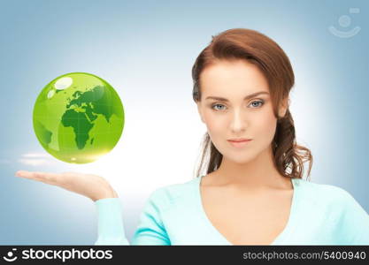 picture of woman holding green globe on her hand