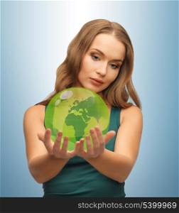 picture of woman holding green globe on her hands