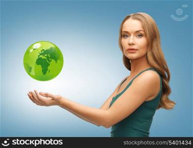 picture of woman holding green globe on her hands