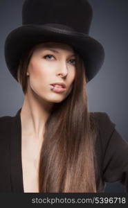 picture of woman in black jacket and top hat