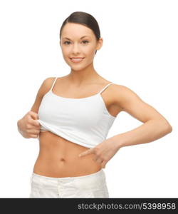 picture of woman in blank shirt showing her belly