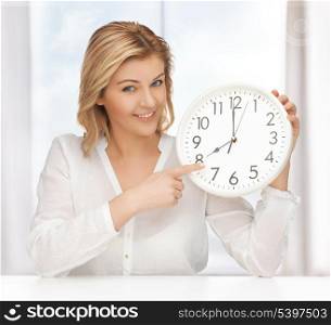 picture of woman in casual clothes with clock