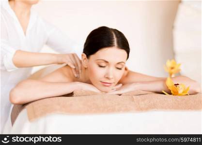 picture of woman in spa salon getting massage. woman in spa
