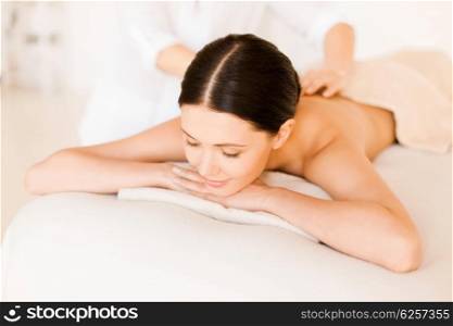 picture of woman in spa salon getting massage. woman in spa