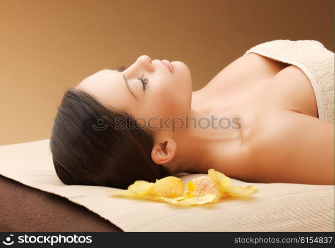 picture of woman in spa salon lying on the massage desk. woman in spa salon lying on the massage desk