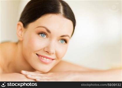 picture of woman in spa salon lying on the massage desk. woman in spa