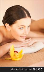 picture of woman in spa salon lying on the massage desk. woman in spa
