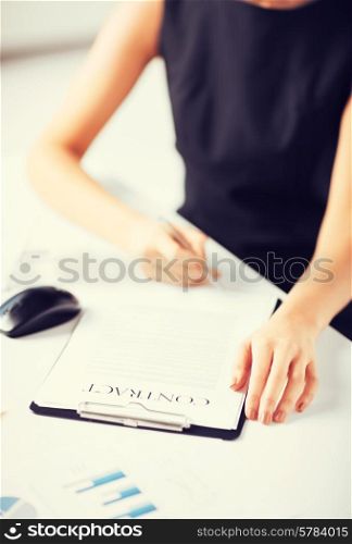 picture of woman thinking about signing a contract