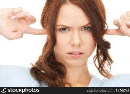 picture of woman with fingers in ears.