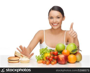 picture of woman with fruits showing thumbs up