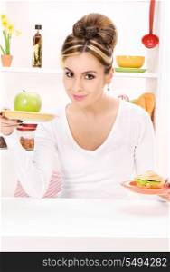 picture of woman with green apple and sandwich