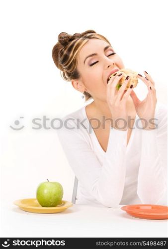 picture of woman with green apple and sandwich
