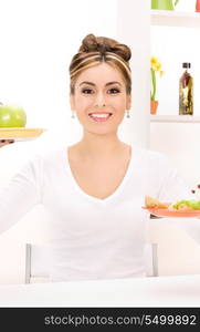 picture of woman with green apple and sandwich