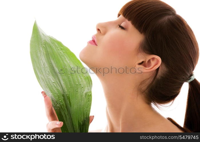 picture of woman with green leaf over white