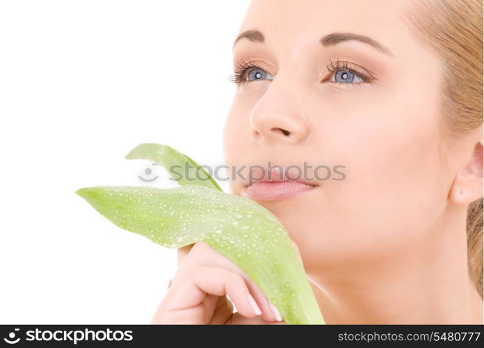 picture of woman with green leaf over white