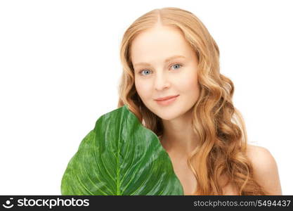 picture of woman with green leaf over white