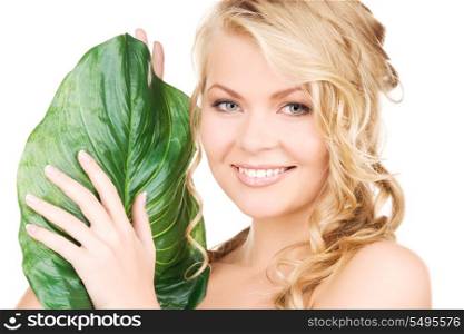 picture of woman with green leaf over white